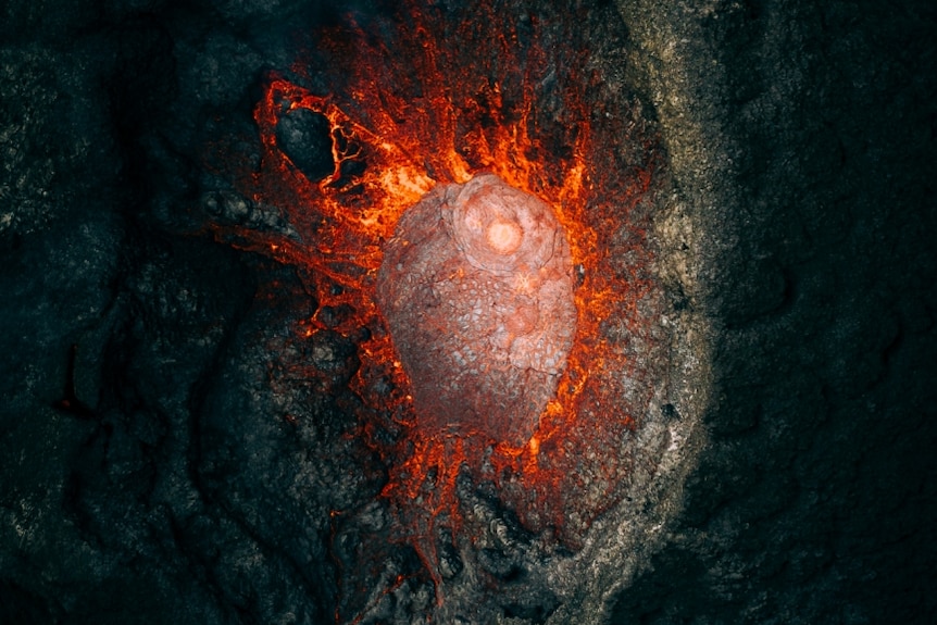 an aerial image of a volcano erupting in iceland